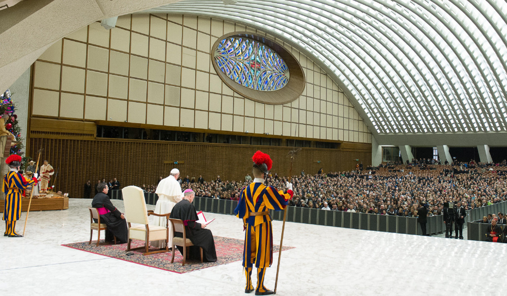 Pope Francis delivers his speech during an audience with the Holy See’s employees in the Paul VI hall at the Vatican on Monday.