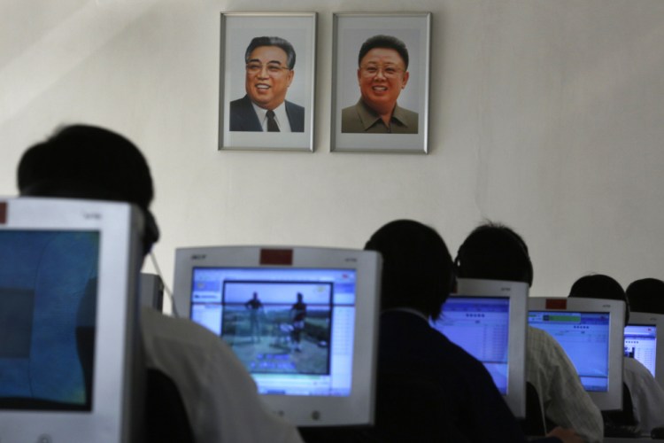 In this Thursday, Sept. 20, 2012 file photo, North Korean students use computers in a classroom with portraits of the country’s later leaders Kim Il Sung, left, and his son Kim Jong Il hanging on the wall at the Kim Chaek University of Technology in Pyongyang.