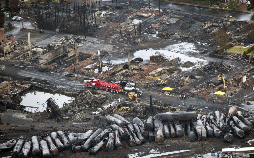 Workers comb through debris after an unmanned train with 72 railway cars carrying crude oil derailed in July 2013, causing explosions in Lac-Megantic, Quebec.