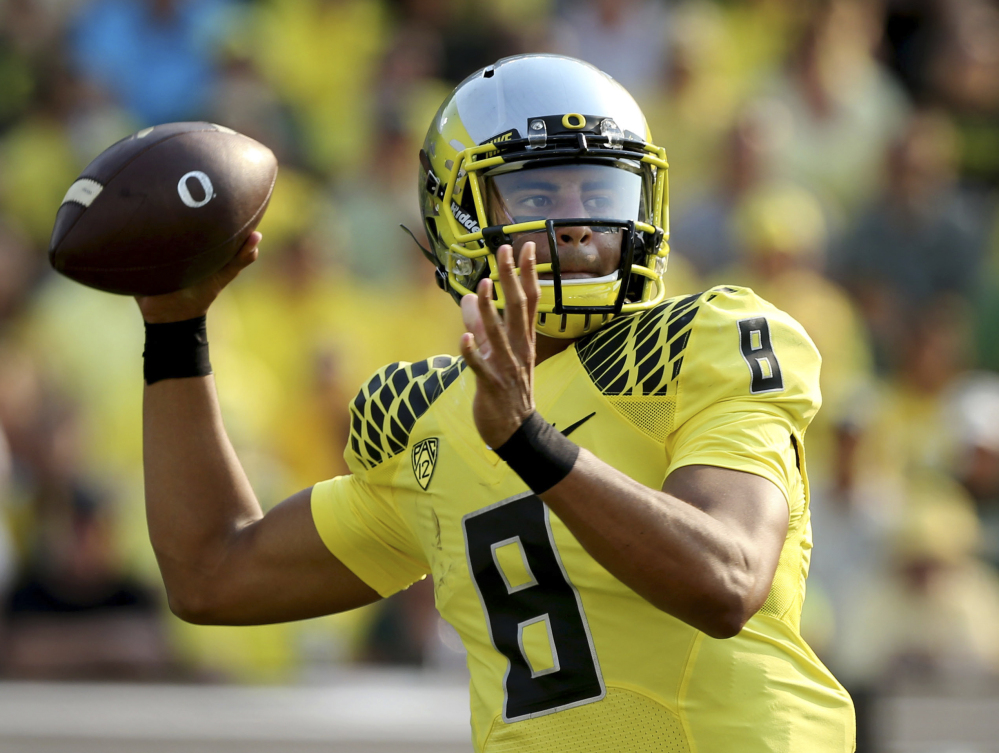 Oregon quarterback Marcus Mariota is The Associated Press college football player of the year. He received 49 of the 54 votes submitted by the AP Top 25 media panel.