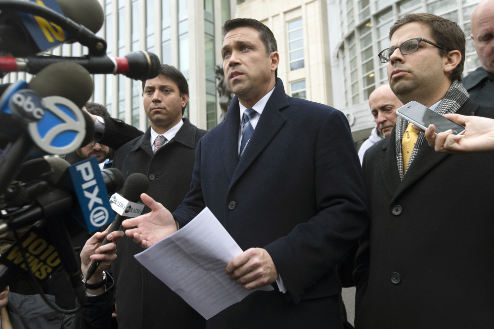Rep. Michael Grimm speaks to the media outside federal court in Brooklyn after pleading guilty Tuesday to a federal tax evasion charge. Grimm had been set to go to trial in February on charges of hiding more than $1 million in sales and wages while running a health-food restaurant in Manhattan