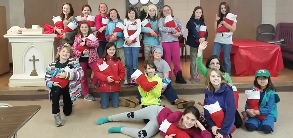 Members Portland Girl Scout Troop 1714 filled stockings for residents of the Preble Street Teen Shelter.