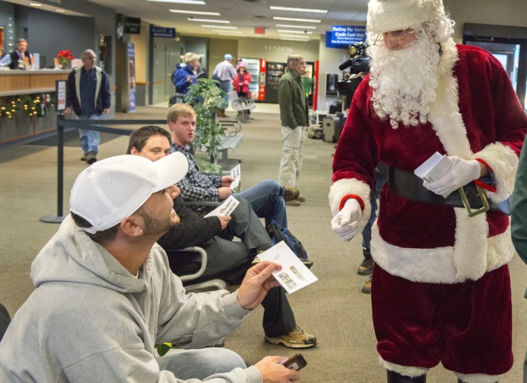 Phil Innis initially thought Secret Santa was an Amtrak employee handing out coupons on Dec. 24, 2014 – until he discovered a $100 bill in the envelope.
<em>John Ewing/Staff Photographer</em>