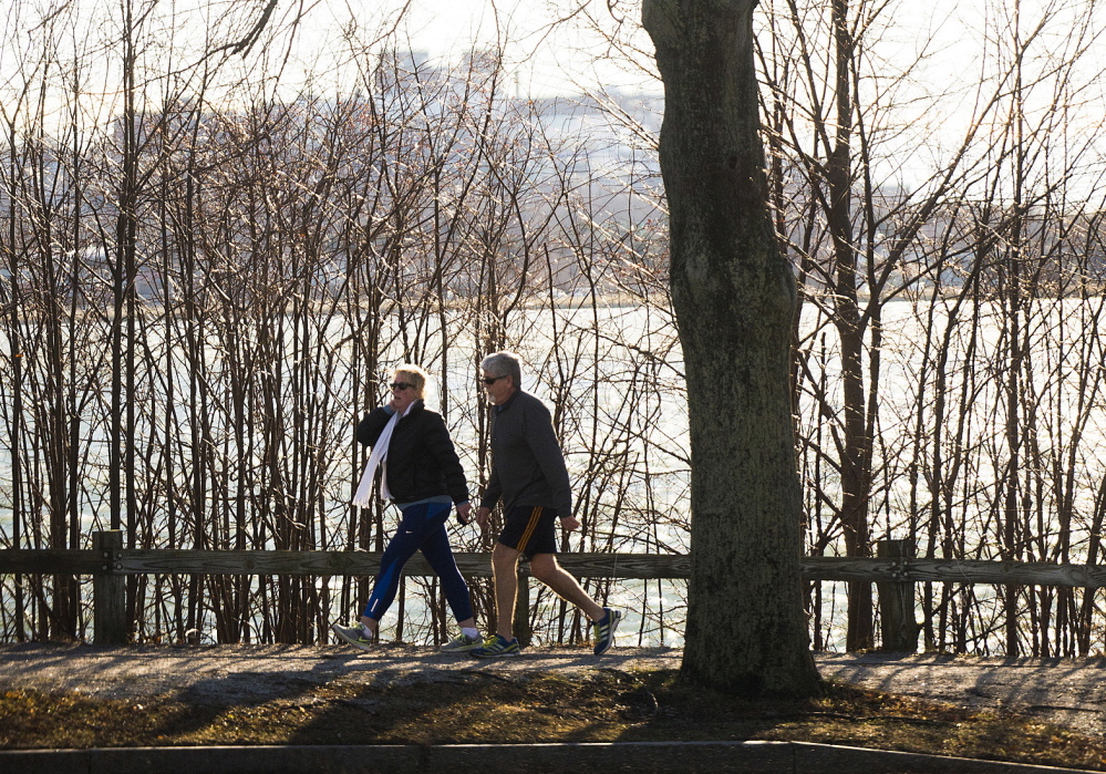DEC. 25: Remember how balmy it was on Christmas Day? It tied for the warmest Dec. 25 on record in Portland, matching the previous high of 53 degrees last set in 1994. People all over Greater Portland got outside to bask in the sun. These two took a brisk stroll around Back Cove in Portland.