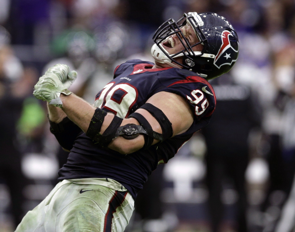 Houston defensive end J.J. Watt celebrates after sacking Ravens quarterback Joe Flacco during a 25-13 win over Baltimore on Sunday. Watt now has 17  sacks to go along with five touchdowns – three on offense and two on defense – all of which has him in the conversation for league MVP.