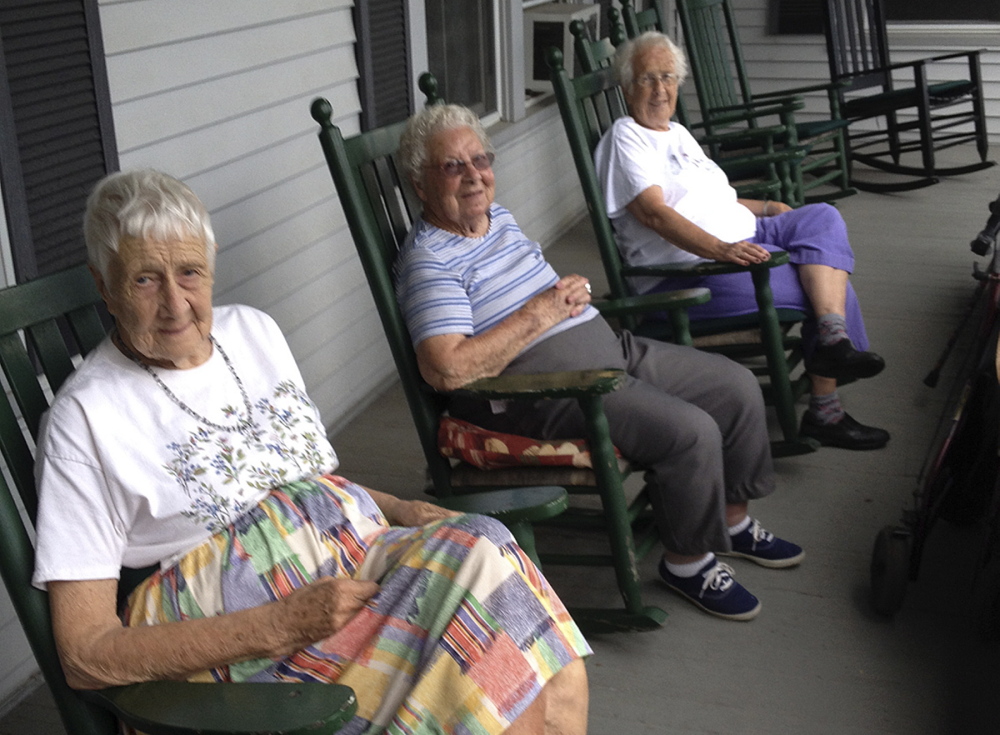 Residents of St. Mark’s Home in Augusta, from left, Margaret Jamison, Eva Sherwood and Nona Treworgy relax on the porch last summer. The three found new homes after learning that St. Mark’s would close by year’s end.