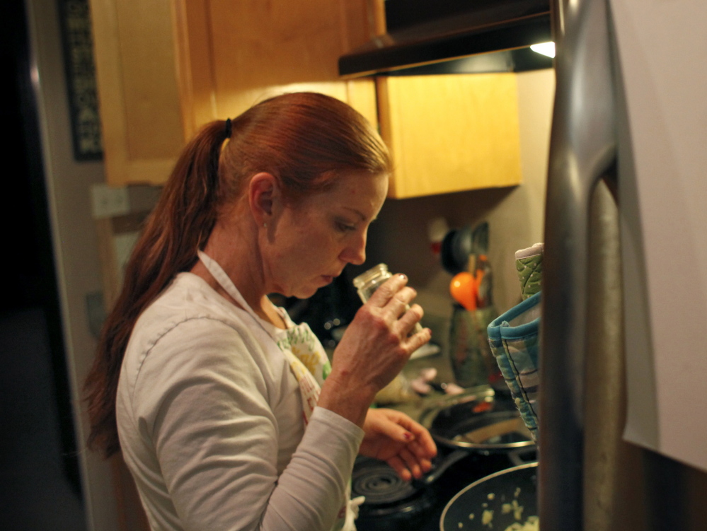 Army veteran Katie Weber, a survivor of military sexual trauma who now spends most of her time doing MST advocacy, prepares dinner at home in Santa Rosa, California on Dec. 4.
