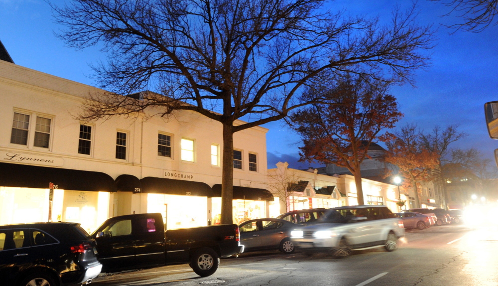 Trees in front of shops along Greenwich Avenue in Greenwich, Conn., were undecorated this Christmas season. Without the lights that usually illuminate trees there, businesspeople and shoppers alike are disappointed.
