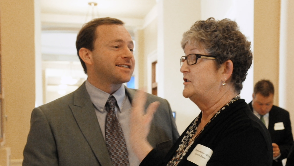 Speaker of the House Mark Eves chats with Rep.-elect Donna Doore, D-Augusta, before orientation day events for new members of the Legislature on Nov. 13. Eves is urging his caucus to “put jobs first.”