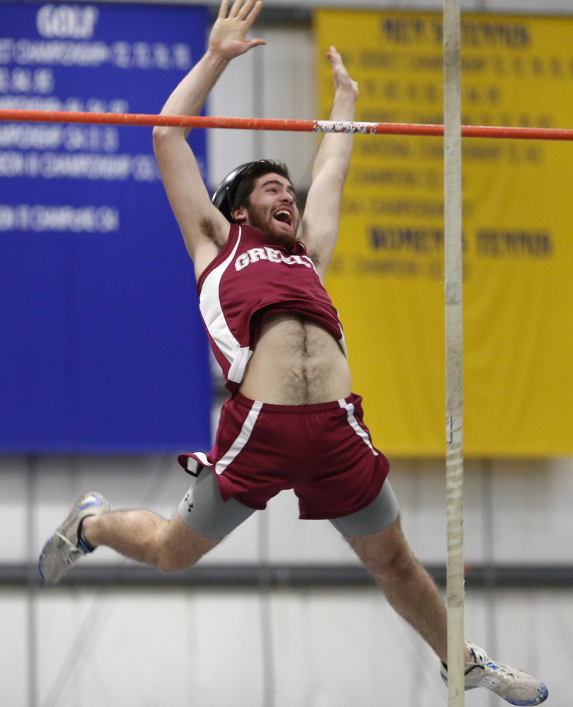Ben Ray of Greely clears the bar with a smile while competing in the pole vault. Ray finished fourth in the event with a vault of 11 feet, 6 inches.