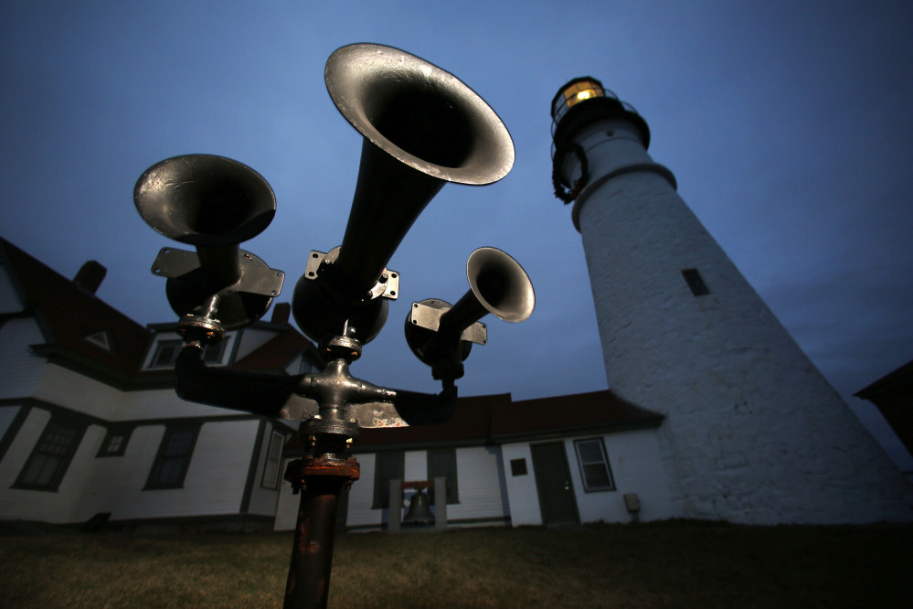 Foghorns that were retired long ago remain aimed toward the sea at Portland Head Light in Cape Elizabeth. The Coast Guard’s plan to convert old-style foghorns to newer technology is drawing criticism.