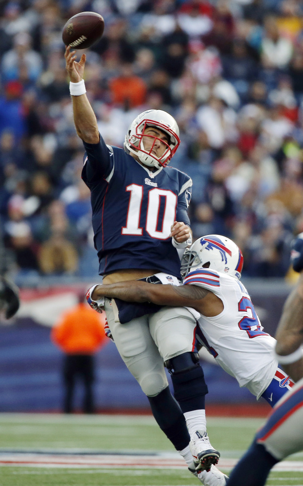 Bills strong safety Duke Williams wraps up Patriots quarterback Jimmy Garoppol.
The Associated Press