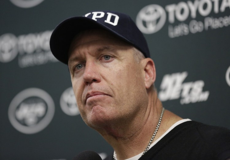 New York Jets head coach Rex Ryan listens to a question during a news conference Sunday after a game against the Miami Dolphins,.