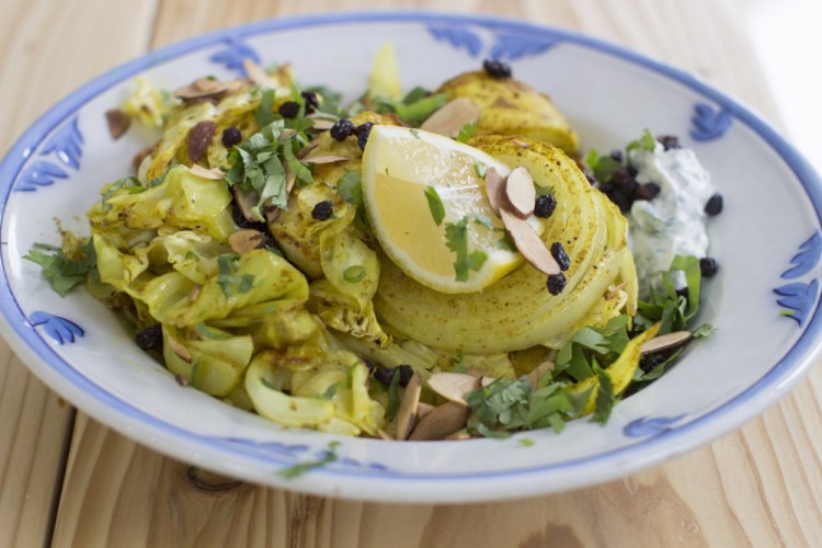 Curried roasted cabbage gets its heat from hot curry powder and its sweetness from apples and currants.