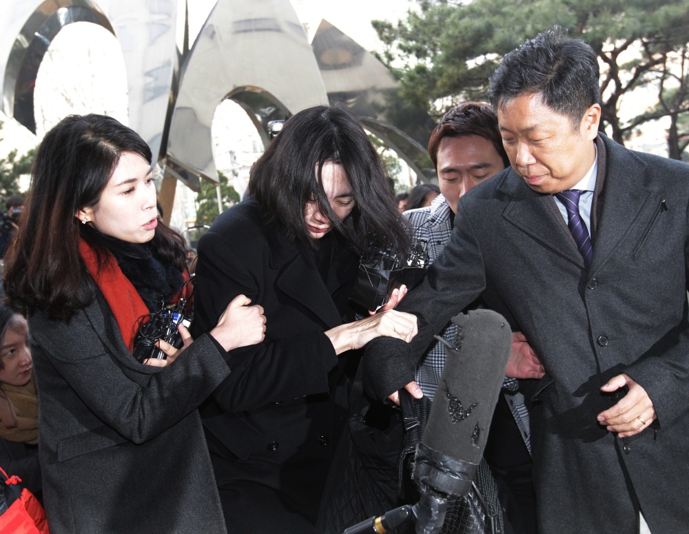 Cho Hyun-ah, center, former vice president of Korean Air Lines, arrives at the Seoul Western District Prosecutors Office in South Korea, on Tuesday. A court is expected to decide whether to arrest Cho in the ‘nut rage’ case.
