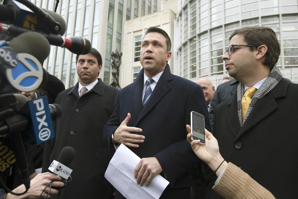 Rep. Michael Grimm speaks to the media outside Federal court in Brooklyn after pleading guilty to a federal tax evasion charge on Dec. 23. Grimm had been set to go to trial in February on charges of evading taxes by hiding more than $1 million in sales and wages while running a health-food restaurant.