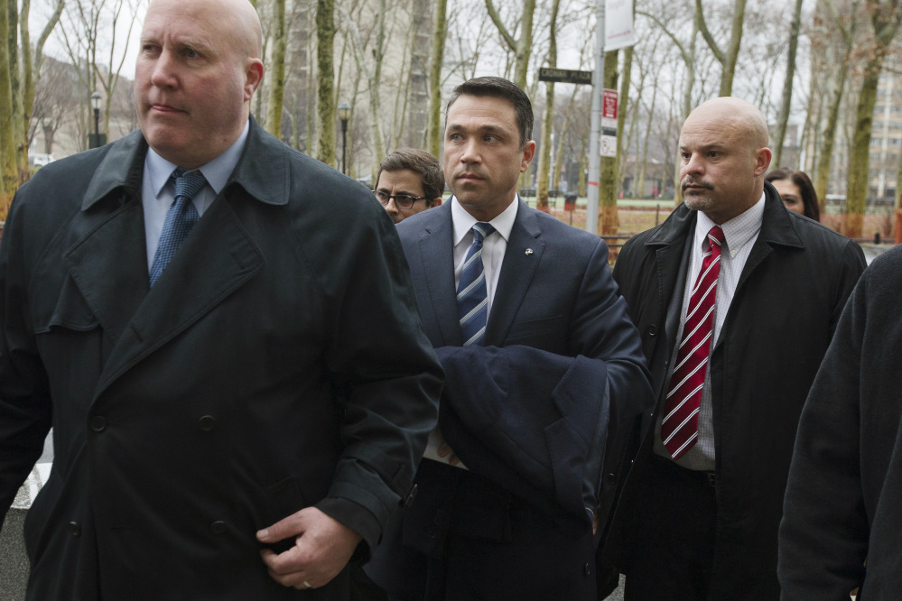Rep. Michael Grimm, center, enters Federal court in Brooklyn before pleading guilty to a federal tax evasion charge rather than go to trial, Tuesday, in New York.