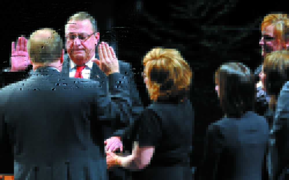 Gov. Paul LePage takes the oath of office at the start of his first term, in 2011.