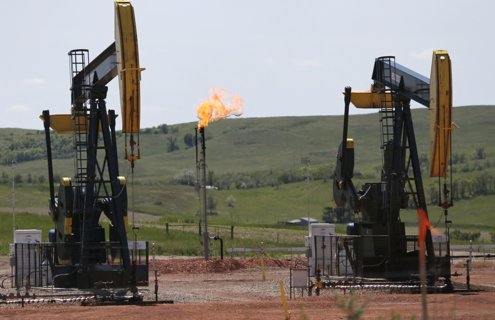 Methane flares off an oil well in North Dakota above. A methane “hot spot” in New Mexico is as large as the state of Delaware according to NASA. The gas will likely be a flashpoint as the government tries to regulate leaks in the new year.