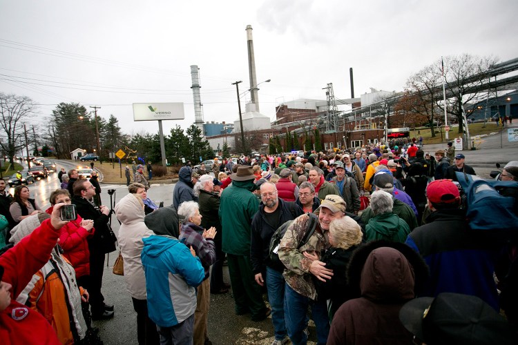 Workers leaving the Verso Paper mill are greeted by hundreds of community members as their final shift ends on Dec. 17. A statement Tuesday said at least $18 million will be paid to 500 hourly workers who lost their jobs when the mill closed.