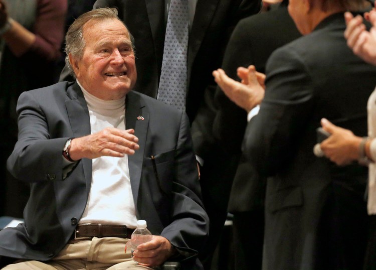 Former President George H.W. Bush acknowledges the crowd at his presidential library in College Station, Texas, on Nov. 11, 2014.