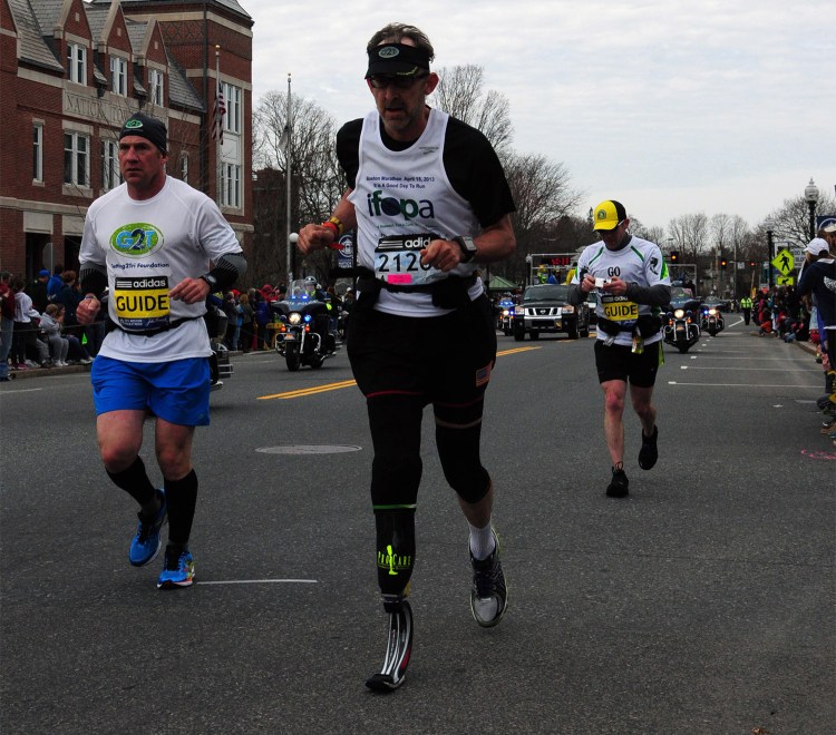 Richard Blalock reaches the finish line of the 2013 Boston Marathon.
