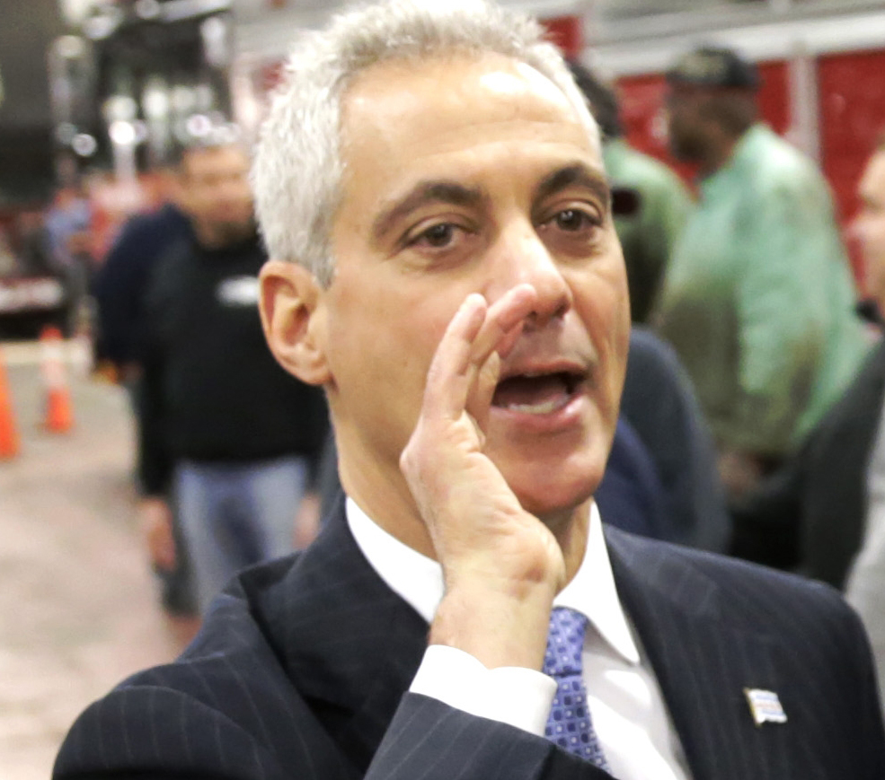 Chicago Mayor Rahm Emanuel wishes city employees at a maintenance facility a happy Thanksgiving during a visit last week in Chicago. Emanuel is seeking a second term. The Associated Press