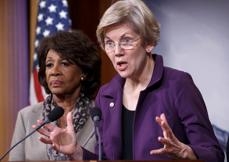 Sen. Elizabeth Warren, D-Mass., a member of the Senate Banking Committee, and Rep. Maxine Waters, D-Calif., left, ranking member of the House Financial Services Committee, express their outrage to reporters Wednesday that a huge, $1.1 trillion spending bill passed by the Republican-controlled House contains changes to the 2010 Dodd-Frank law that regulates complex financial instruments. Democratic support for the omnibus bill faded as liberal lawmakers erupted over the financial regulation provision and another that allows more money to flood into political parties.