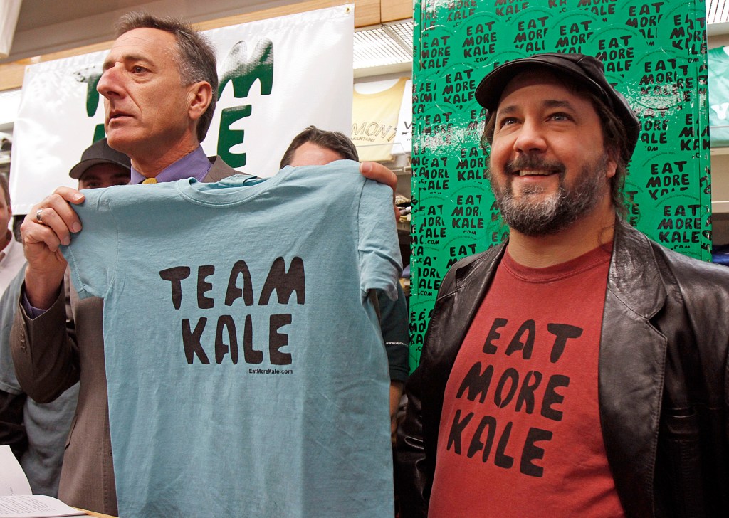 Vermont Gov. Peter Shumlin holds a Team Kale T-shirt during a news conference with Bo Muller-Moore in 2011.
