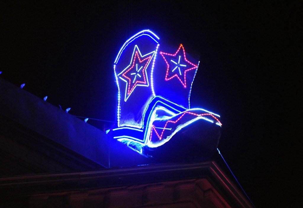 A lighted cowboy boot drop resting on the roof of the Palace Saloon, officially marking the start of the 2014 new year on Whiskey Row in downtown Prescott, Ariz. Televised images every year of New York City’s glittery ball drop in Times Square have become inextricably linked with New Year’s Eve. But Times Square isn’t the only place to ring in the new year with an object dropping from the sky at midnight.