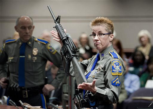 Firearms training unit Detective Barbara J. Mattson of the Connecticut State Police holds a Bushmaster AR-15 in this 2013 photo. It is the same make and model of the gun used by Adam Lanza in the Sandy Hook Elementary School shooting. 