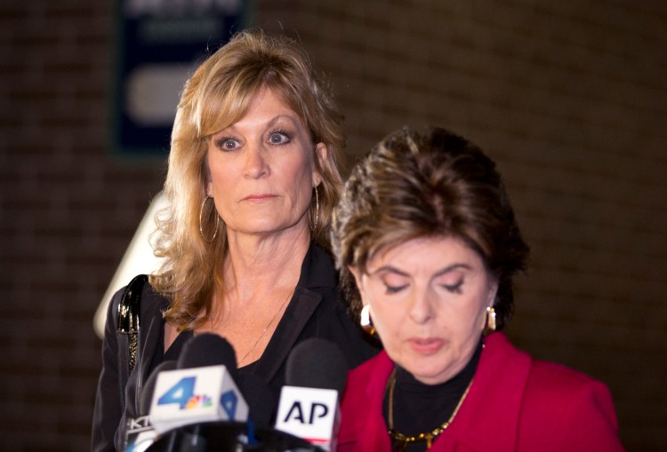 Judy Huth, left, appears at a press conference with attorney Gloria Allred outside the Los Angeles Police Department's Wilshire Division station on Friday. Allred announced that they have met with Los Angeles police detectives to open a formal investigation into claims Bill Cosby molested Huth when she was 15 years old in a bedroom of the Playboy Mansion.