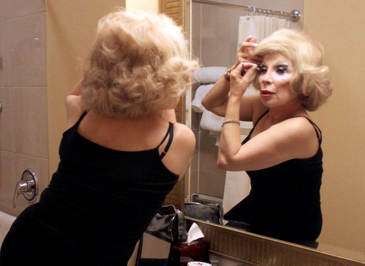 Linda Axelrod, a celebrity impersonator who also inhabits Marilyn Monroe and Charo, transforms into Joan Rivers before a charity event in November. Washington Post photo by Jessica Contrera