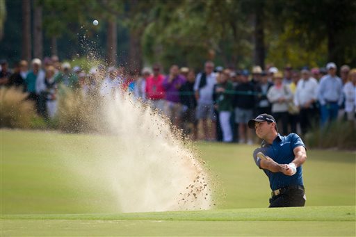 Jason Day hits from a sand trap to the ninth green during the second round of the Franklin Templeton Shootout on Friday. Day and his teammate, Cameron Tringale, finished in the lead. The Associated Press
