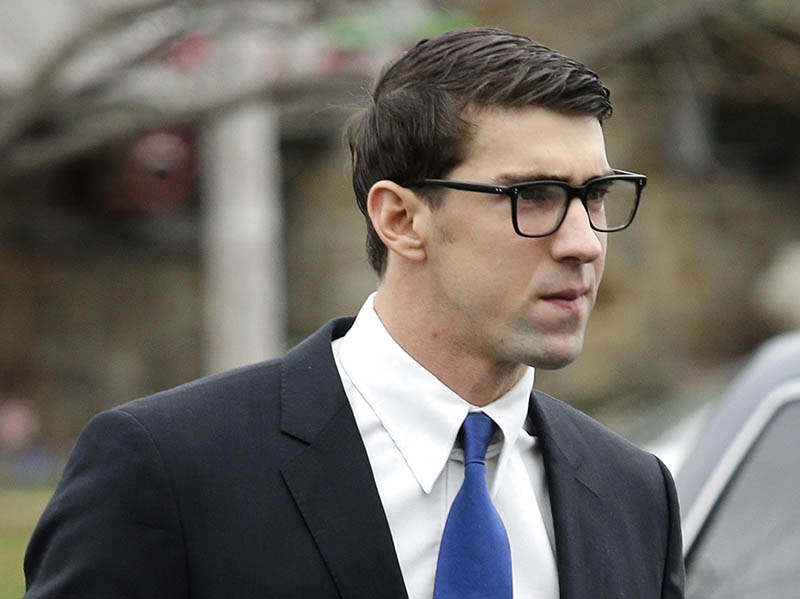Olympic swimmer Michael Phelps walks into a courthouse for a trial on drunken driving and other charges, on Friday.
