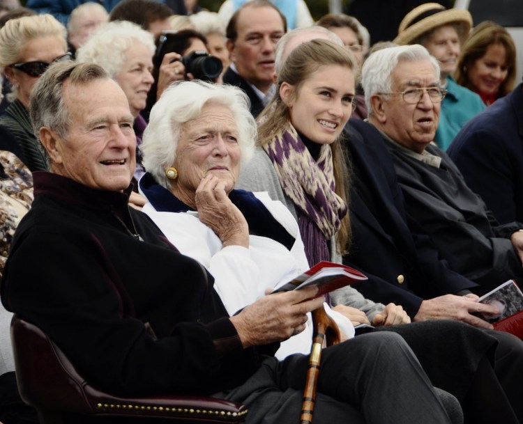 Former President George H. W. Bush, wife Barbara Bush, and granddaughter Lauren Bush enjoy festivities at Walker's Point in Kennebunkport during the dedication of an anchor and plaque in his honor at the overlook there. 
