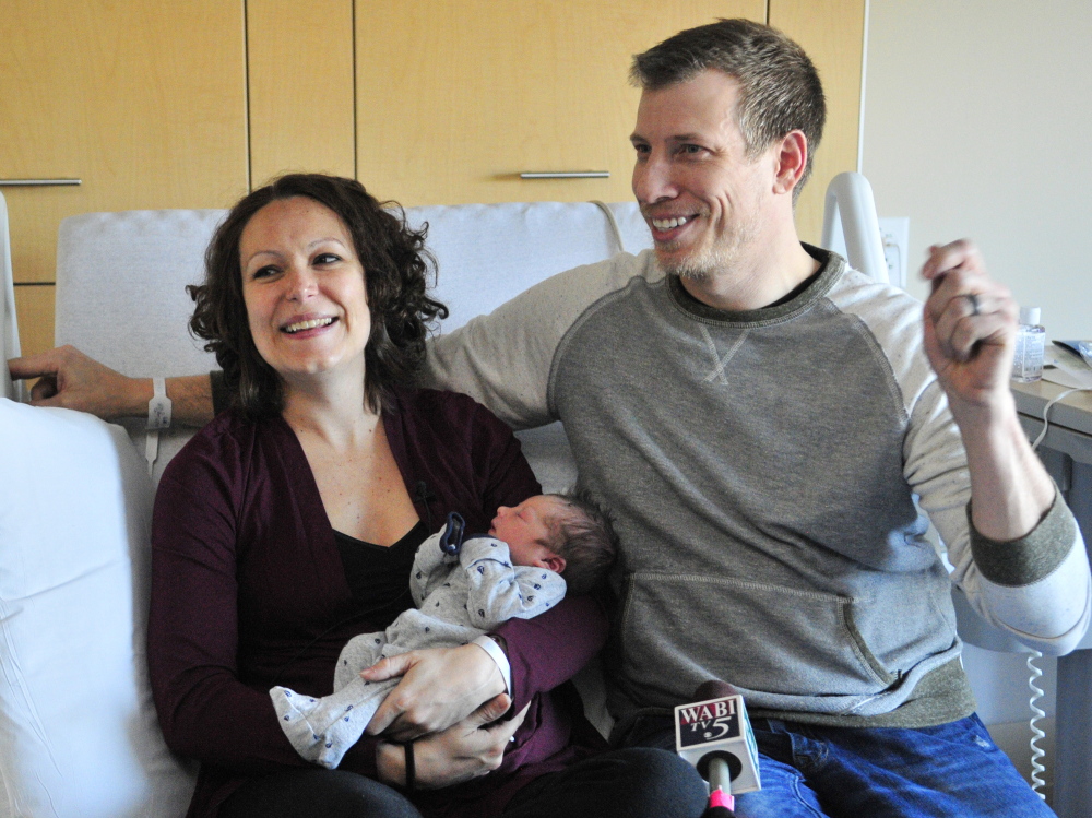 Amanda Adcock of Gardiner holds Wil, Maine’s first baby of 2015, as she and Wil’s father, Chad Vander Lugt, talk to reporters Thursday at MaineGeneral Medical Center in Augusta. Wil was born at 12:48 a.m.