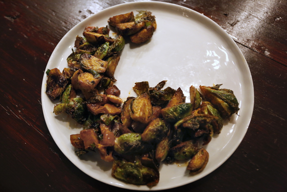 Roasted Brussels sprouts come with salt, pimenton, pork lardons and Marcona almonds.