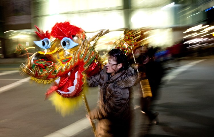 Anna Foo, 14, of Cumberland, manipulates the dragon’s head.  In China, the public holiday officially begins Feb. 19 (with Feb. 18 as Chinese New Year’s Eve) this year and, according to the Chinese zodiac, 2015 is a year of the goat.
