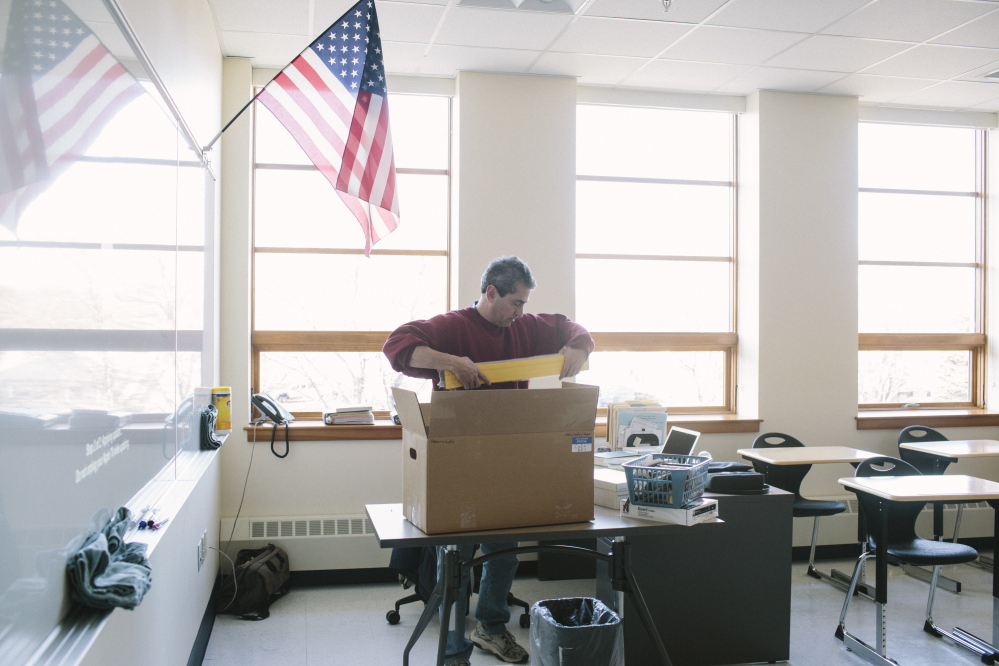 South Portland High School Spanish teacher Henry Coll unpacks a box of materials for his new classroom in a recently completed addition to the school on Friday. His new classroom features additional outlets, storage and technology.