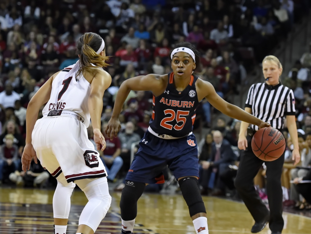 Auburn’s Neydja Petithomme, right, looks to make a move while defended by South Carolina’s Bianca Cuevas during the second half of South Carolina’s 77-58 win Friday at Columbia, S.C. With the win the top-ranked Gamecocks remain undefeated, improving to 13-0.