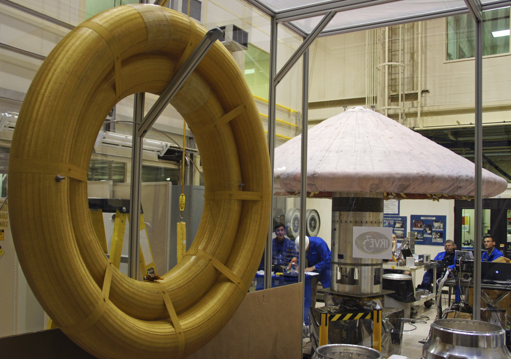 A hypersonic inflatable aerodynamic decelerator, which consists of high-tech fabric rings, is shown in 2012 at NASA Langley in Hampton, Va. NASA acknowledges that getting people safely to and from Mars as early as the 2030s will pose extreme challenges.
