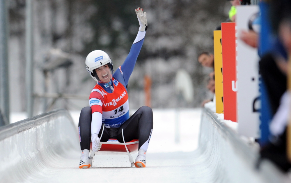 Emily Sweeney, a Falmouth native now living in Connecticut, celebrates Saturday after finishing fourth in a women’s luge World Cup race in Koenigssee, Germany. “I was just trying to have two solid runs,” she said.