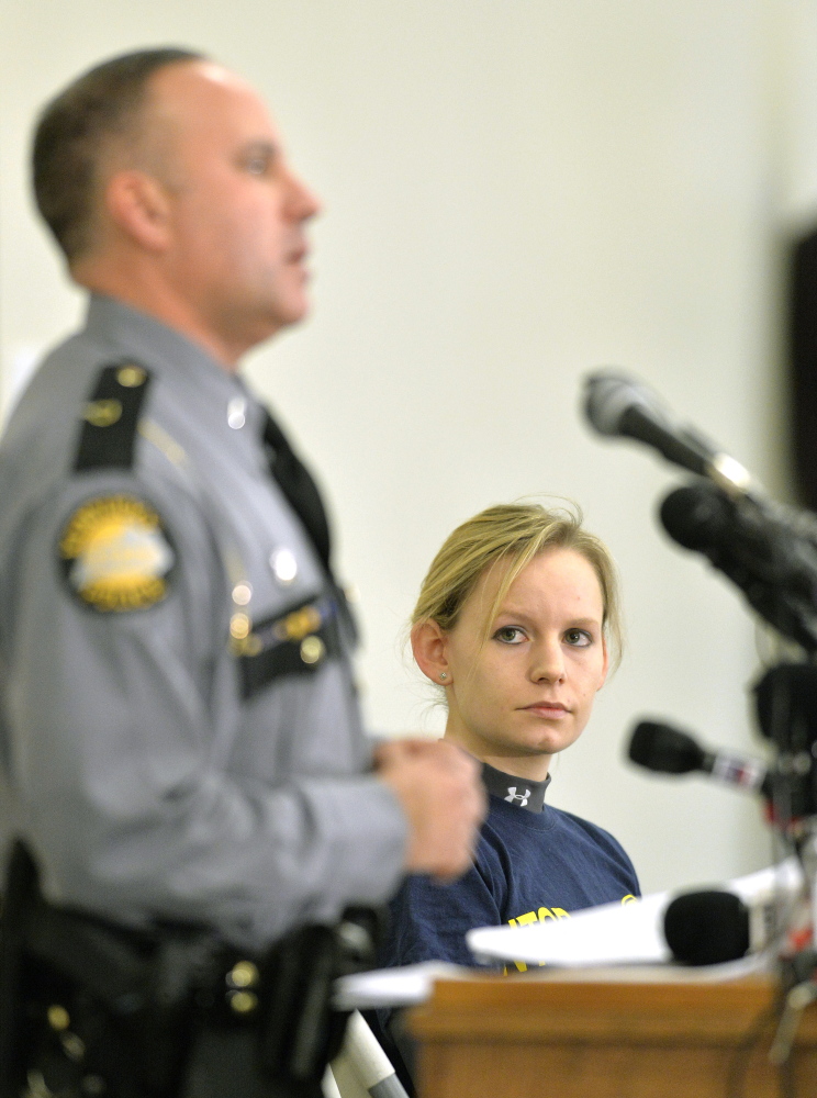 Heidi Moats, right, a National Transportation Safety Board investigator, listens as Kentucky State Police Lt. Brent White speaks at a news conference Sunday in Eddyville, Ky.