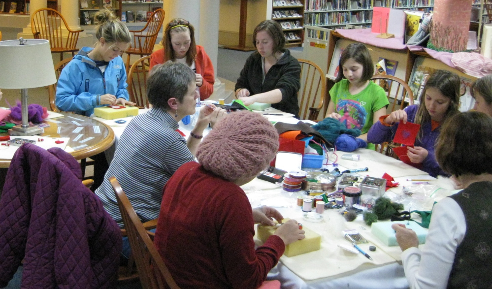 Participants work on projects at a needle felting workshop. A new felting class will be offered at the Camden Public Library on Tuesday.