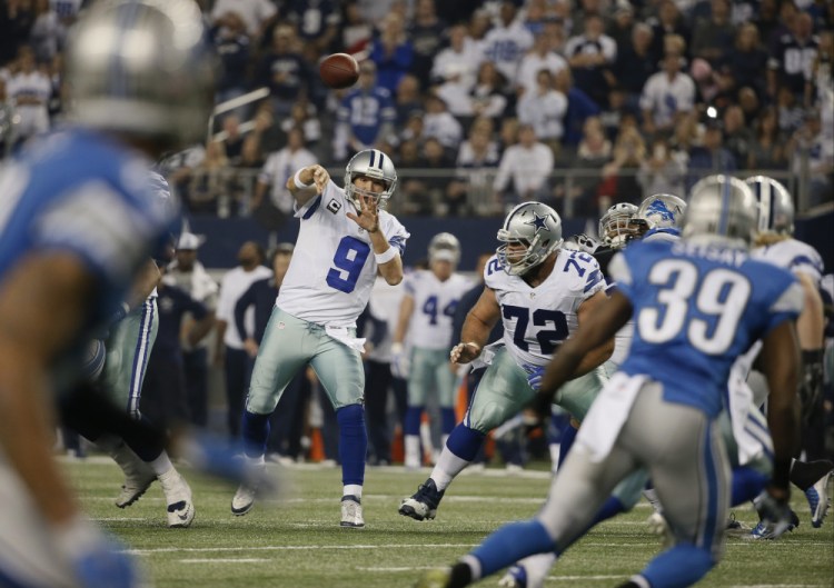 Dallas Cowboys quarterback Tony Romo (9) throws a pass during the second half of an NFL wildcard playoff football game against the Detroit Lions, Sunday, in Arlington, Texas.