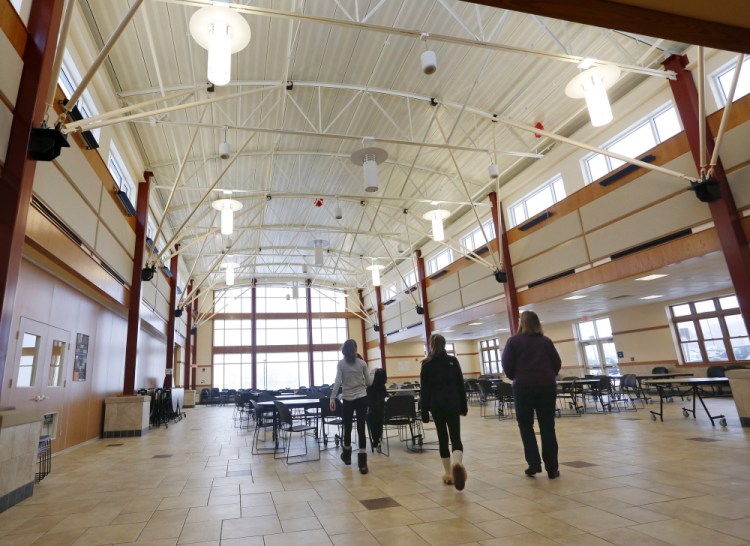 People visit the new cafeteria during an open house Sunday at South Portland High School to view the completed $47.3 million renovation and expansion. The construction process lasted nearly three years.