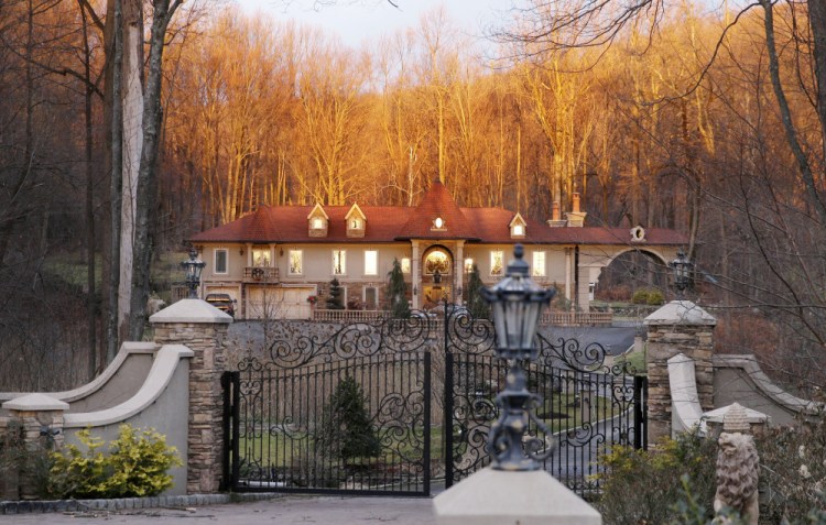 A bright sunrise shines on the home of Teresa Giudice, a cast member of Bravo’s “Real Housewives of New Jersey,” and her husband Giuseppe “Joe” Giudice Monday, in the Towaco section of Montville Township, N.J.