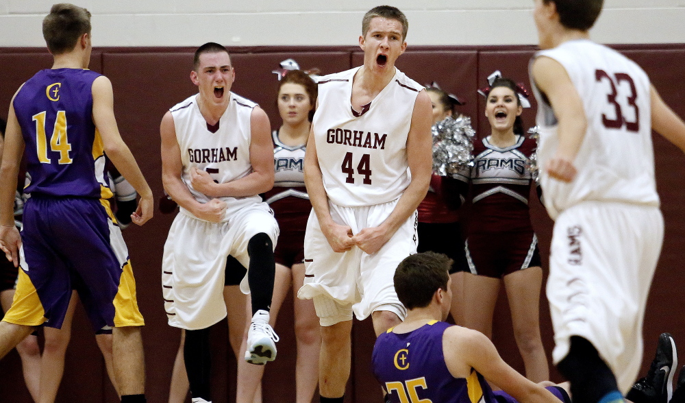 Gorham’s Tyler Bernaiche, left, and Billy Ruby, get pumped in the final second of the third quarter after Ruby’s three-point play tied the game at 38. Bernaiche opened the fourth quarter with a 3-pointer and Gorham was on its way to a third straight win, a 58-47 SMAA boys’ basketball victory over visiting Cheverus.