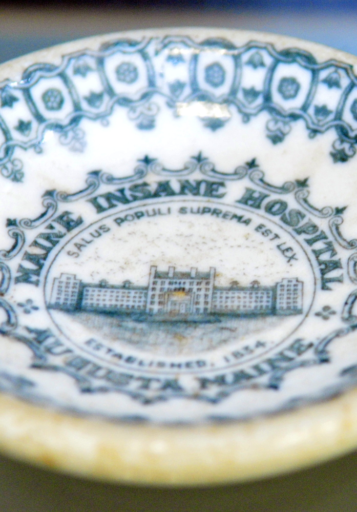 A dish from the Maine Insane Hospital – which later became Riverview Psychiatric Center – is a part of the exhibit which opens next week at the Holocaust and Human Rights Center.